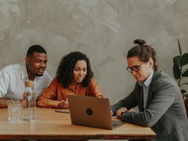 A diverse group of office workers looking relaxed and happy.